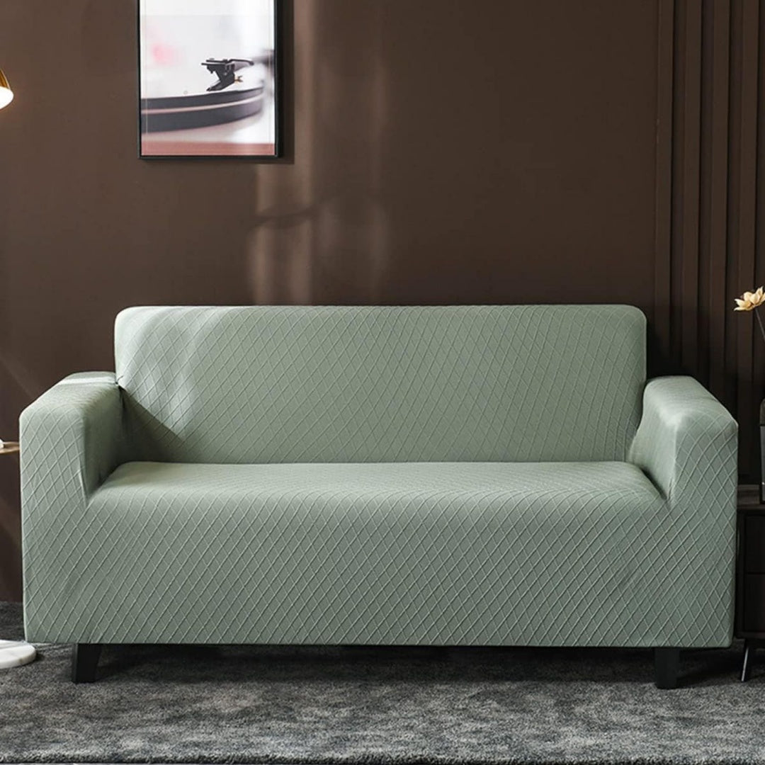 Divano confortevole verde con braccioli